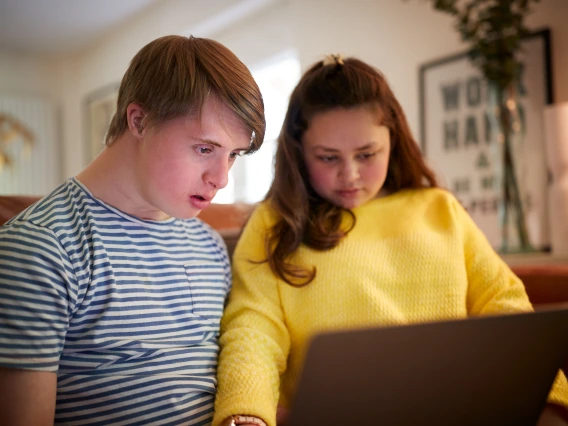 Youth with Support Person on Tablet