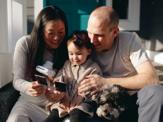 Family Looking At Their Instant Photos