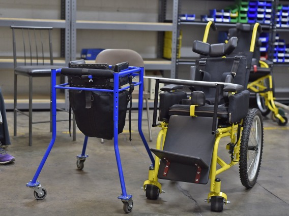 Image of a blue and yellow wheelchair devices