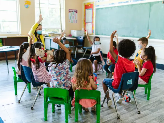 People Sitting on Chairs Inside the Room