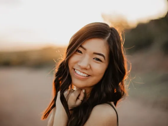 Jodie Tam, an Asian American woman smiling