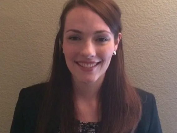 Woman in blazer smiling