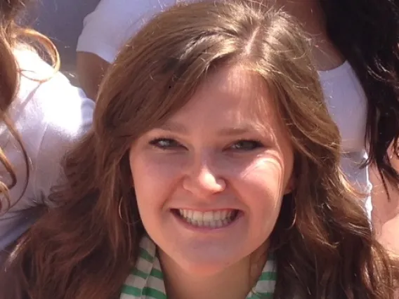 Woman with long wavy hair smiling