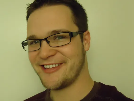 Man in glasses smiling