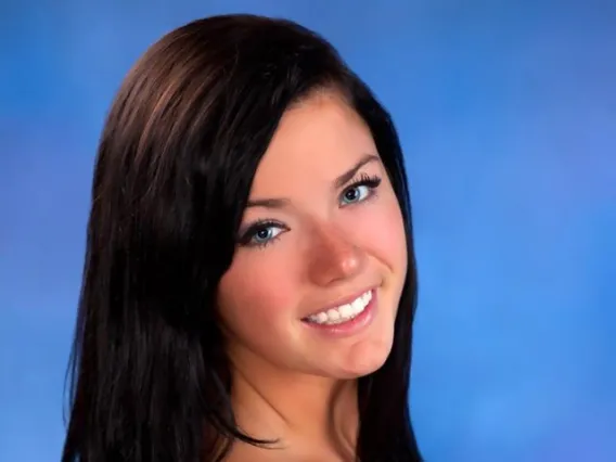 Woman with Dark long hair smiling