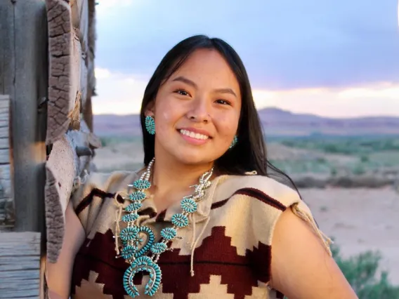 Navajo woman with long brown hair.