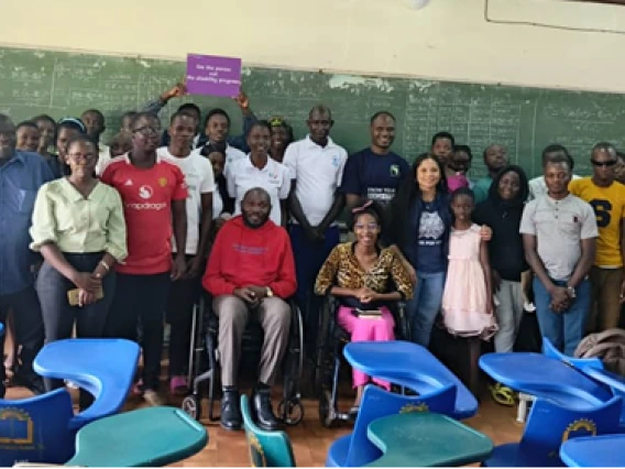 Jacy Farkas with students in Uganda