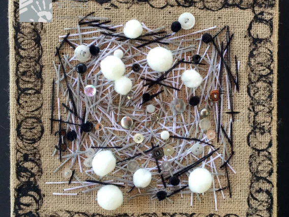 buttons and needles on fabric