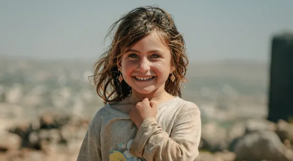 Smiling Kid with Hand on Neck
