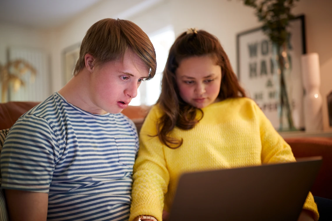 Youth with Support Person on Tablet