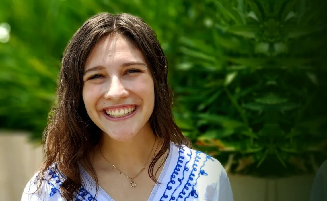 Kayla Tilicki, a white woman with brown hair, smiling.