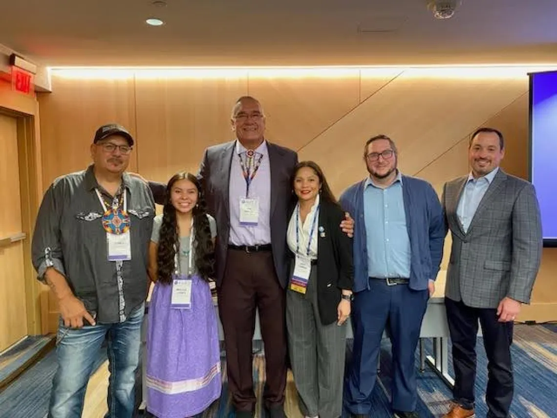 Jim Warne (left center) and Joshua Drywater (second from right) after their presentation