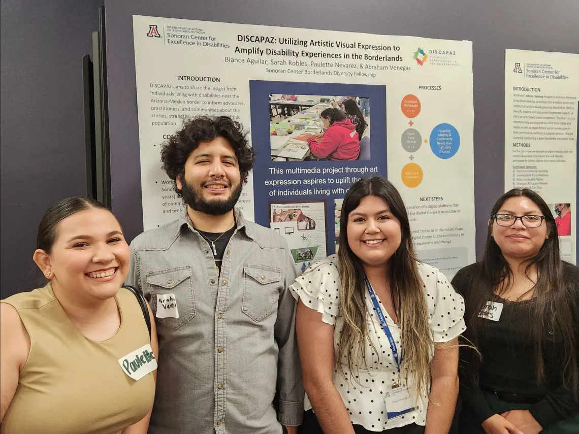 Group of young adults standing in front of an academic poster