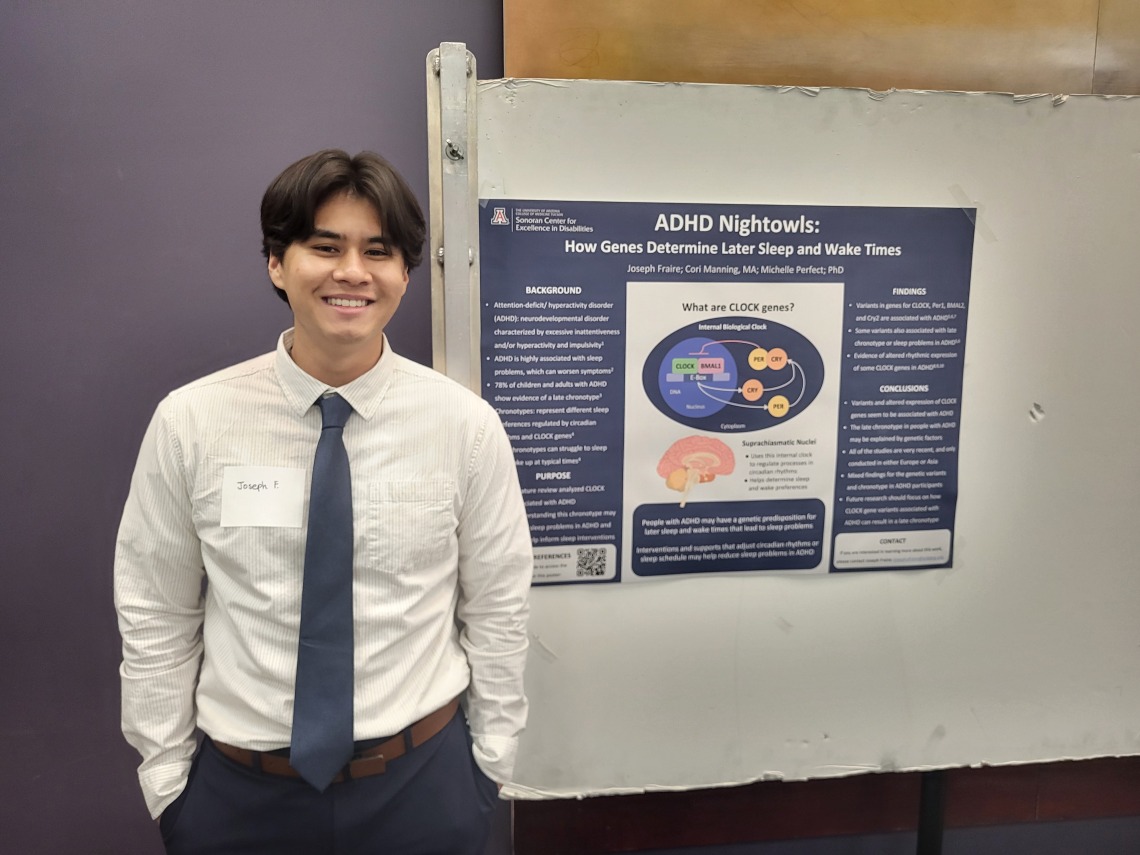 Joseph Fraire stands next to his poster detailing his findings on ADHD and sleep patterns