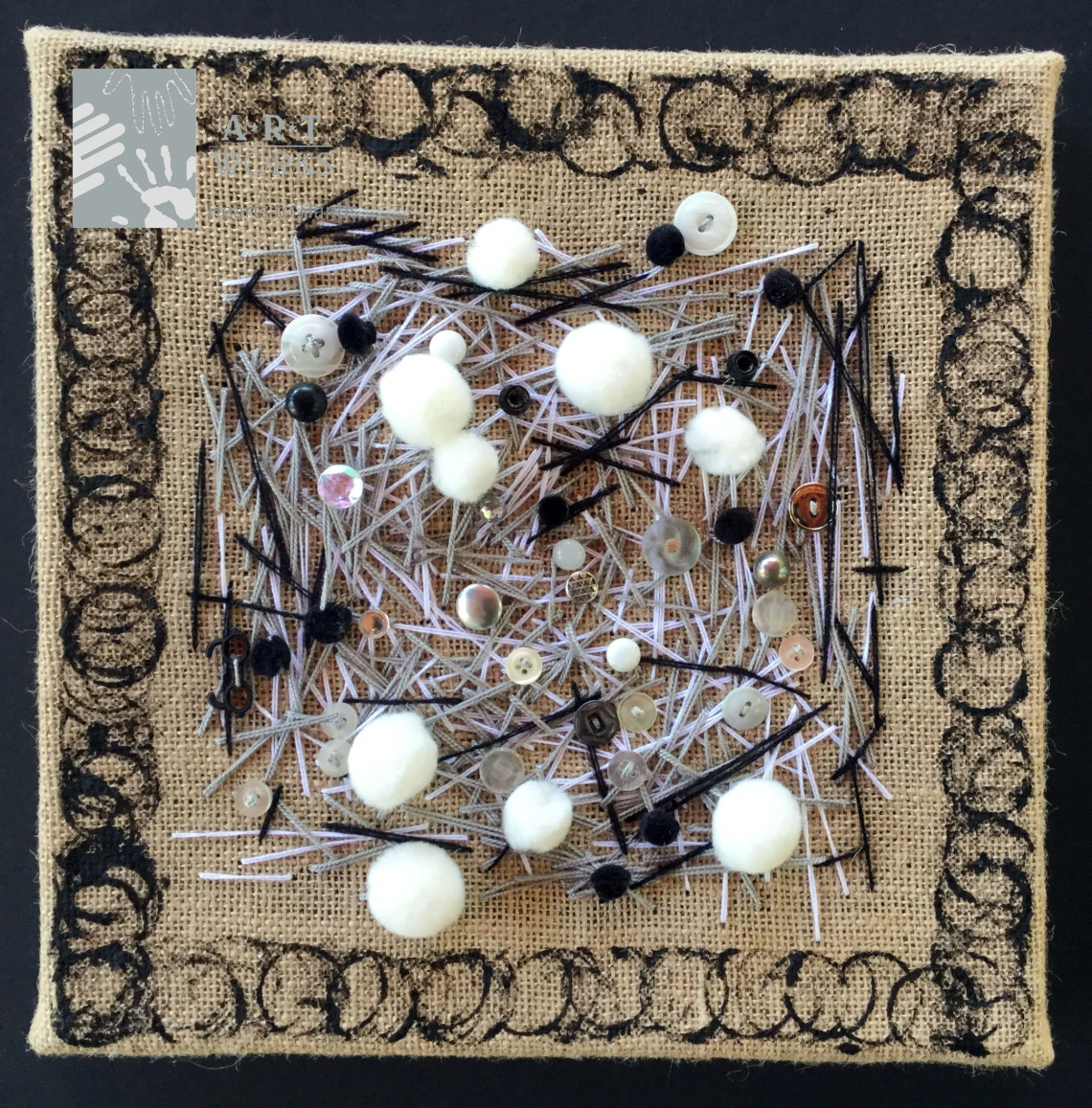 buttons and needles on fabric