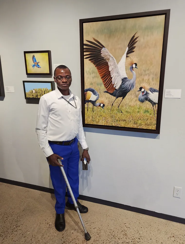  Harunah in front of a wildlife painting inside the Desert Museum.