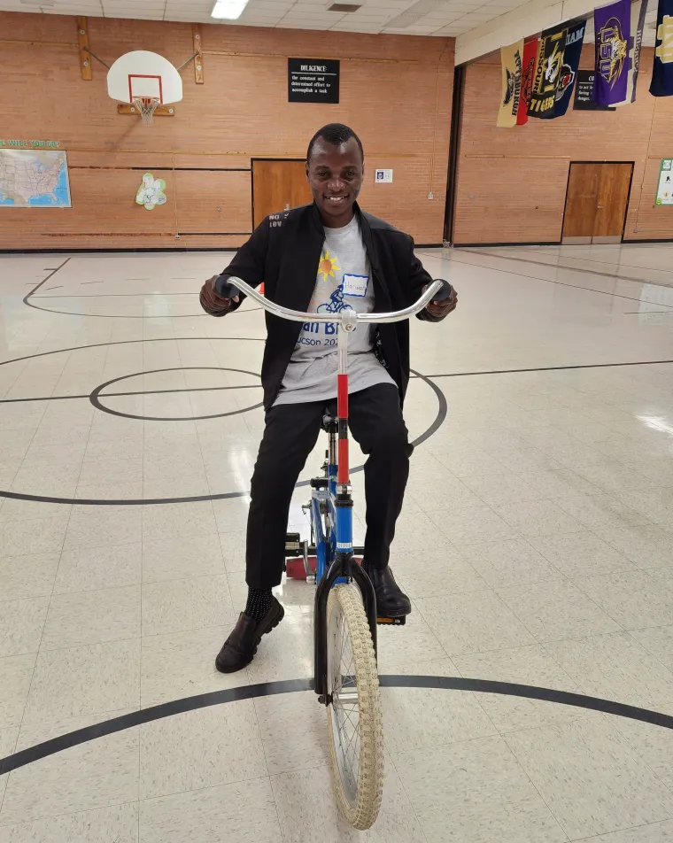 Harunah practicing riding a bicycle