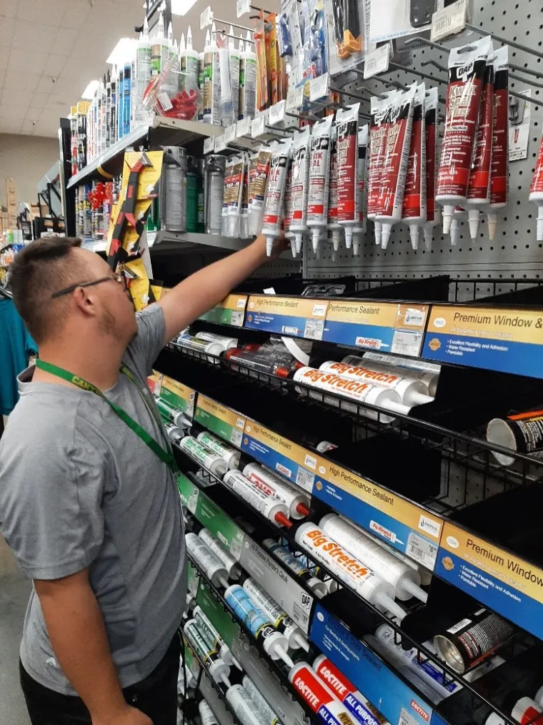 A student worker checks merchandise