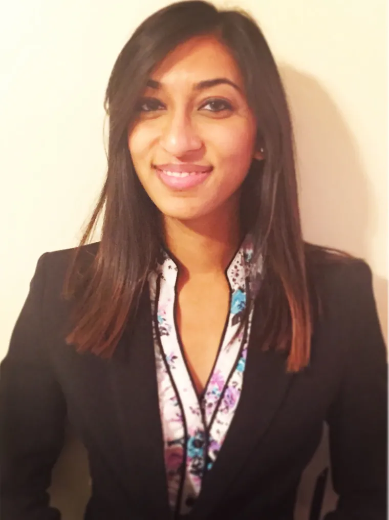 Chandni, a long dark hair woman smiling 