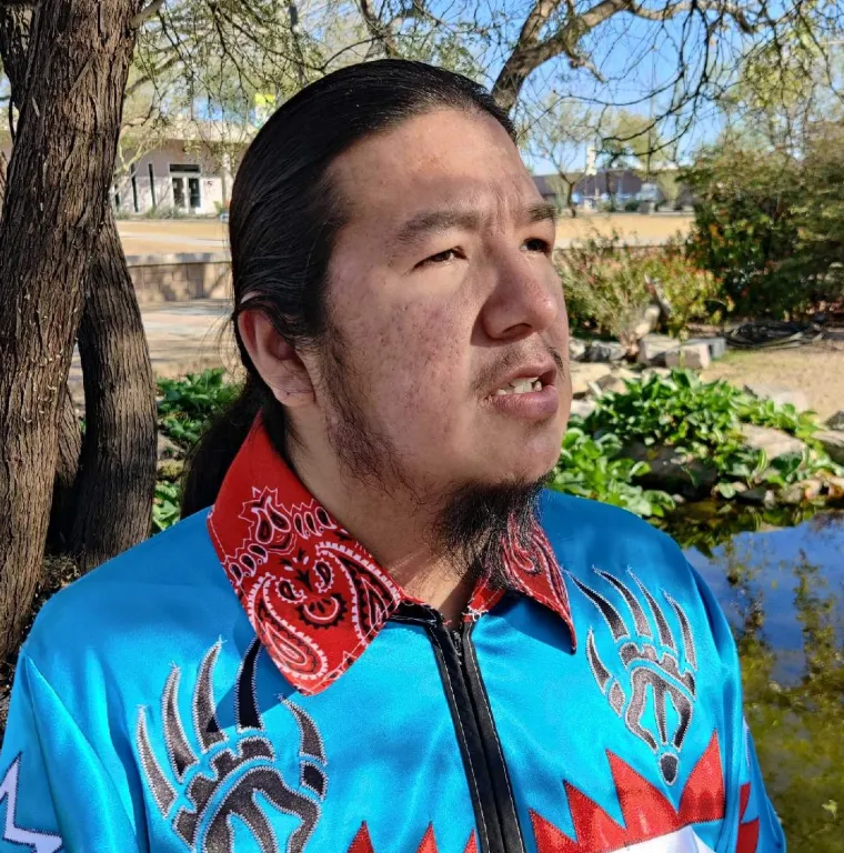 A native man in blue shirt