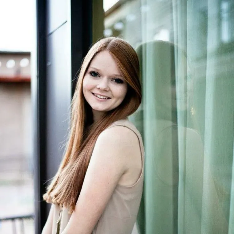 Shelby with long hair smiling