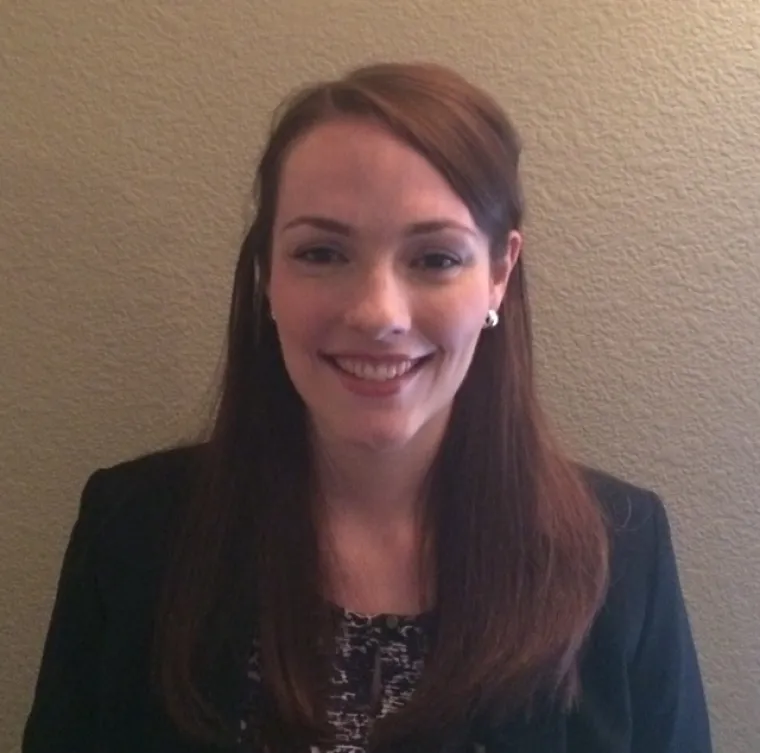 Woman in blazer smiling