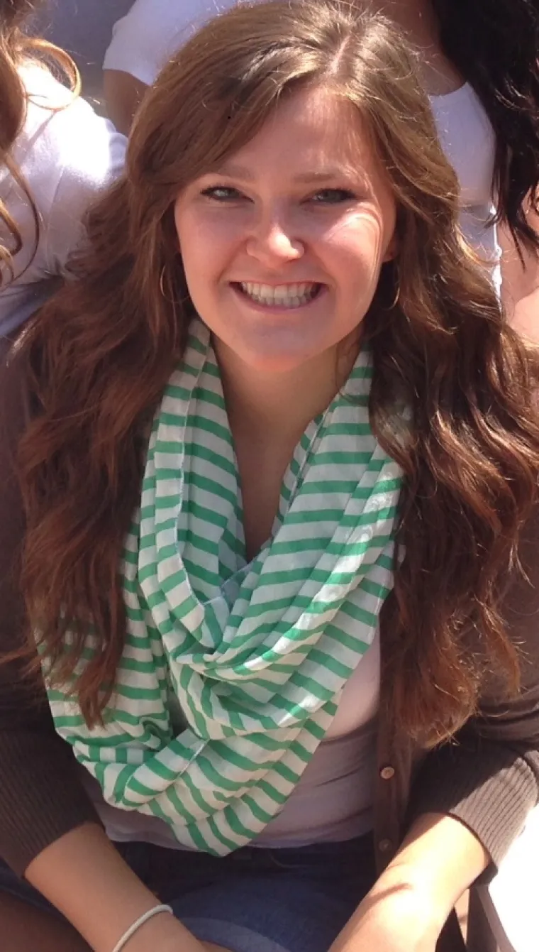 Woman with long wavy hair smiling