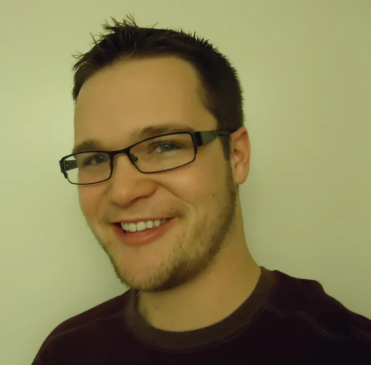 Man in glasses smiling