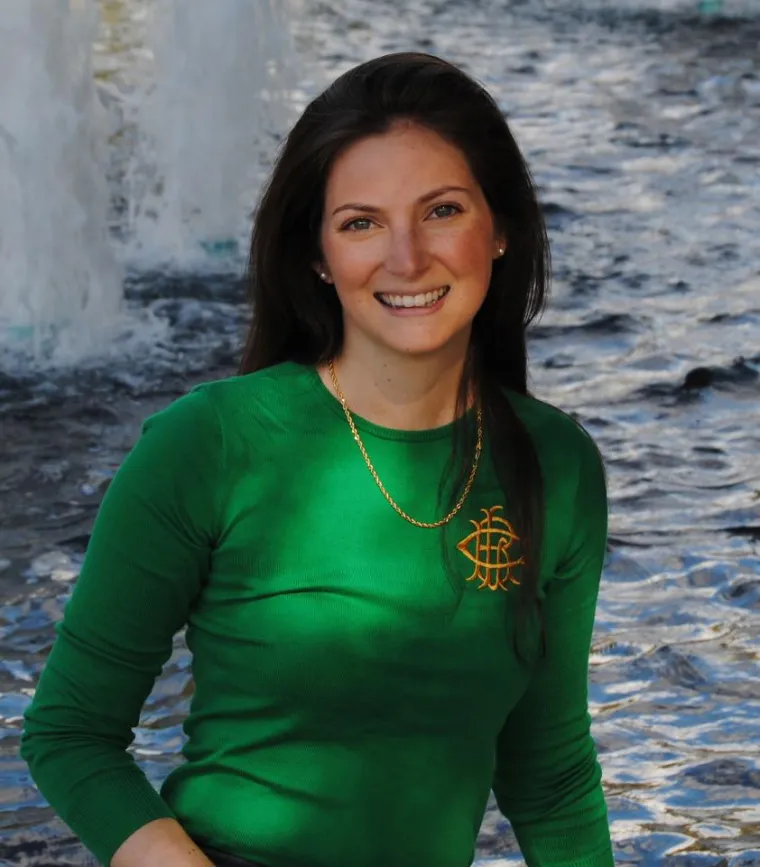 Woman in green top smiling