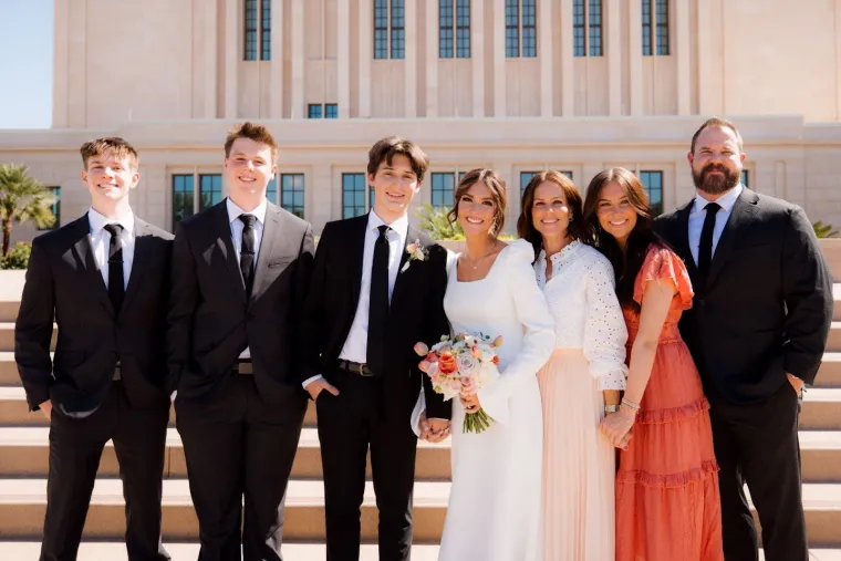 Amber Hansen, pictured with her family, dressed in formal attire. 