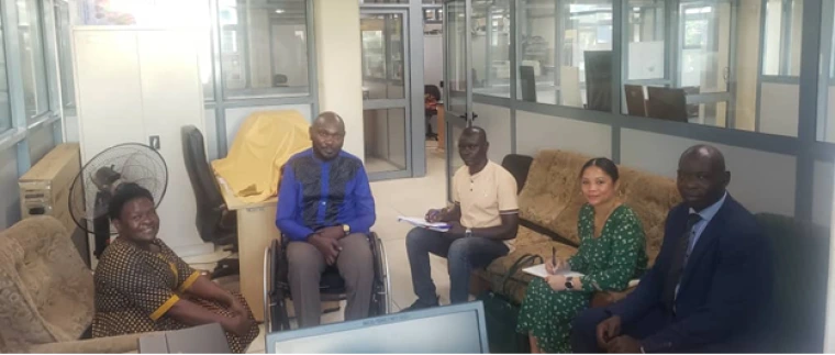 Sarah Ayesiga, Denis Ouma, Jacy Farkas, and Jackson Sanya at the Ministry of Education and Sports