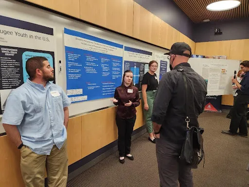 Amber Owens explains her poster detailing her project, "Disability Perspectives: The effects of the COVID-19 Pandemic on the Daily Lives of People With Intellectual Disabilities"