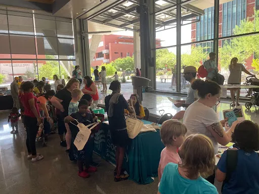 Crowds of community members received free back-to-school supplies and interacted with community organizations.