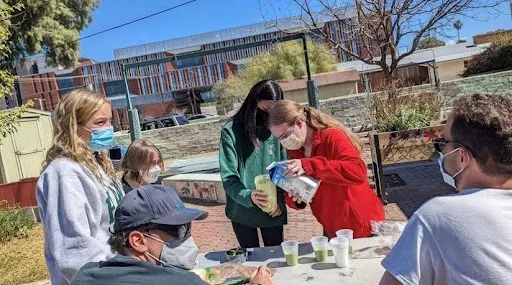 Six people outside, with smoothies