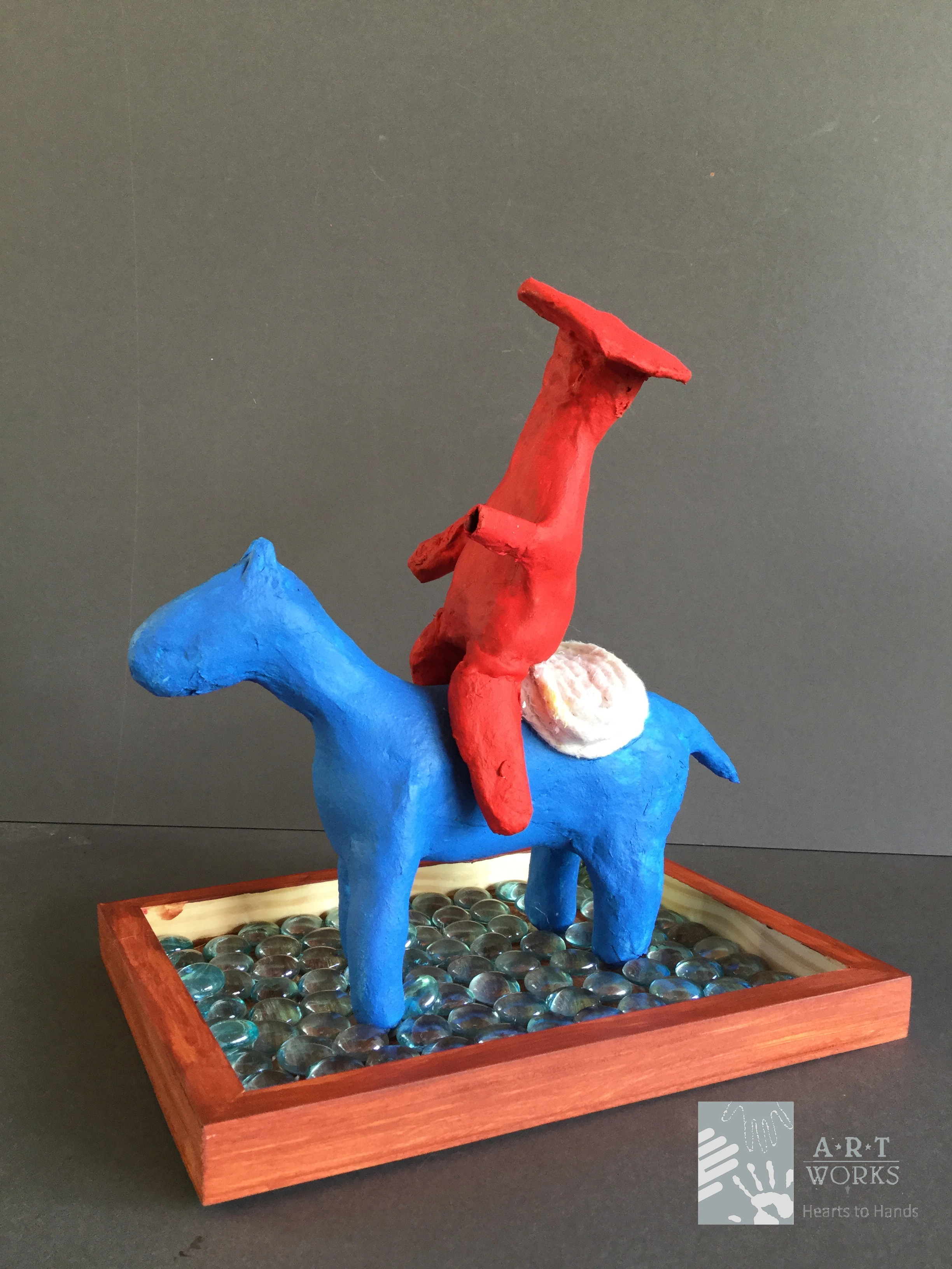 clay figure of person on horse