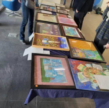 A table displaying the various pieces for sale at the silent auction