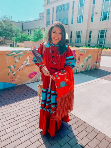 Young Native woman wearing traditional indigenous regalia