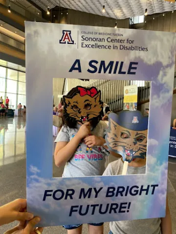 Community members stopped to pose at the event’s photo booth.