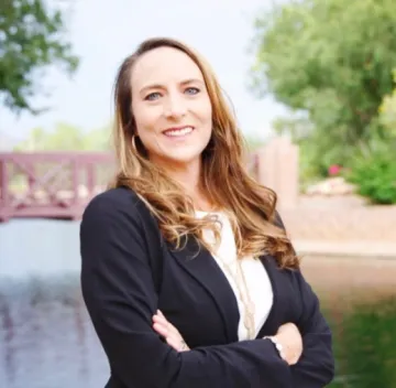 Headshot of Stephanie Johnson, a white woman with long light brown hair wearing a blazer.