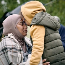 Picture of Refugee mother and child with their heads together