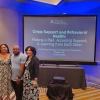 Jacy Farkas, David Taylor, and Barbara Brent smile in front of the title slide to their presentation, Crisis and Behavioral Health: Making a Plan and Accessing Support, Learning from Each Other