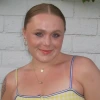 Kendall Smith, a young person with fair skin and light brown hair in a yellow top, smiling