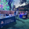 The Sonoran Center table at Dream Night, lit by a peacock-style light fixture