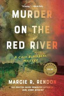 Book cover of Murder on the Red River by Marcie R. Rendon, depicting a dirt road cutting between two green fields.