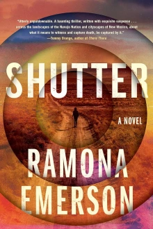 Book cover of Shutter by RamonaEmerson, depicting the silouhette of a figure standing in the middle of a rural desert road. 